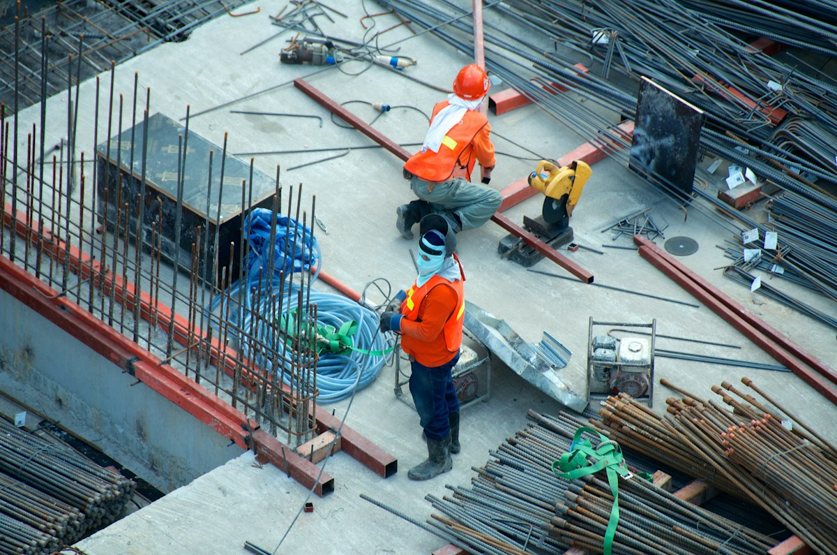 Pre-Purchase Roof Inspection - Expert surveyor and homeowner reviewing chimney and roof structure